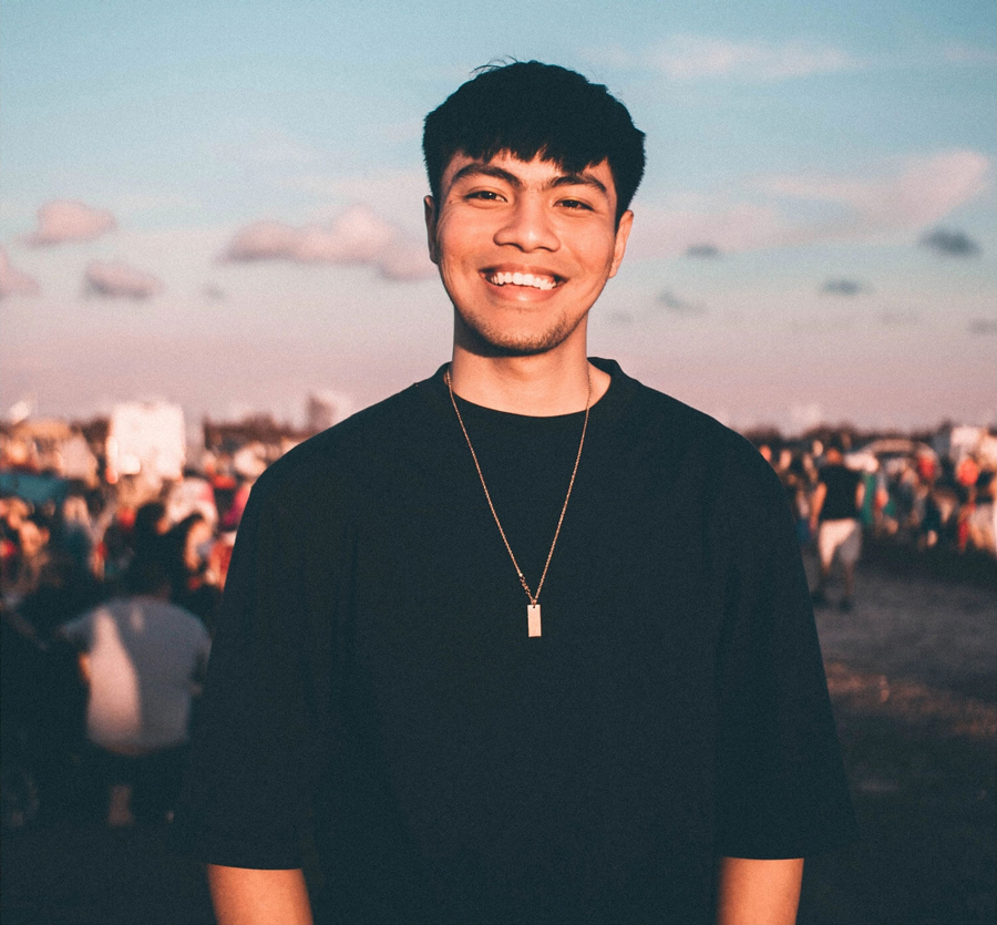 Standing man smiling and looking at the viewer