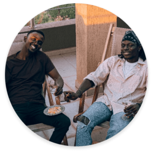 Two smiling men sitting down